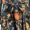 black and orange silk dress in floral crêpe de chine with 3/4-sleeves, V-neck a belted waist ANAIS